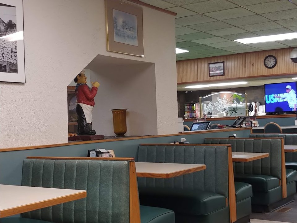 Restaurant interior with a cozy, quiet breakfast feel.